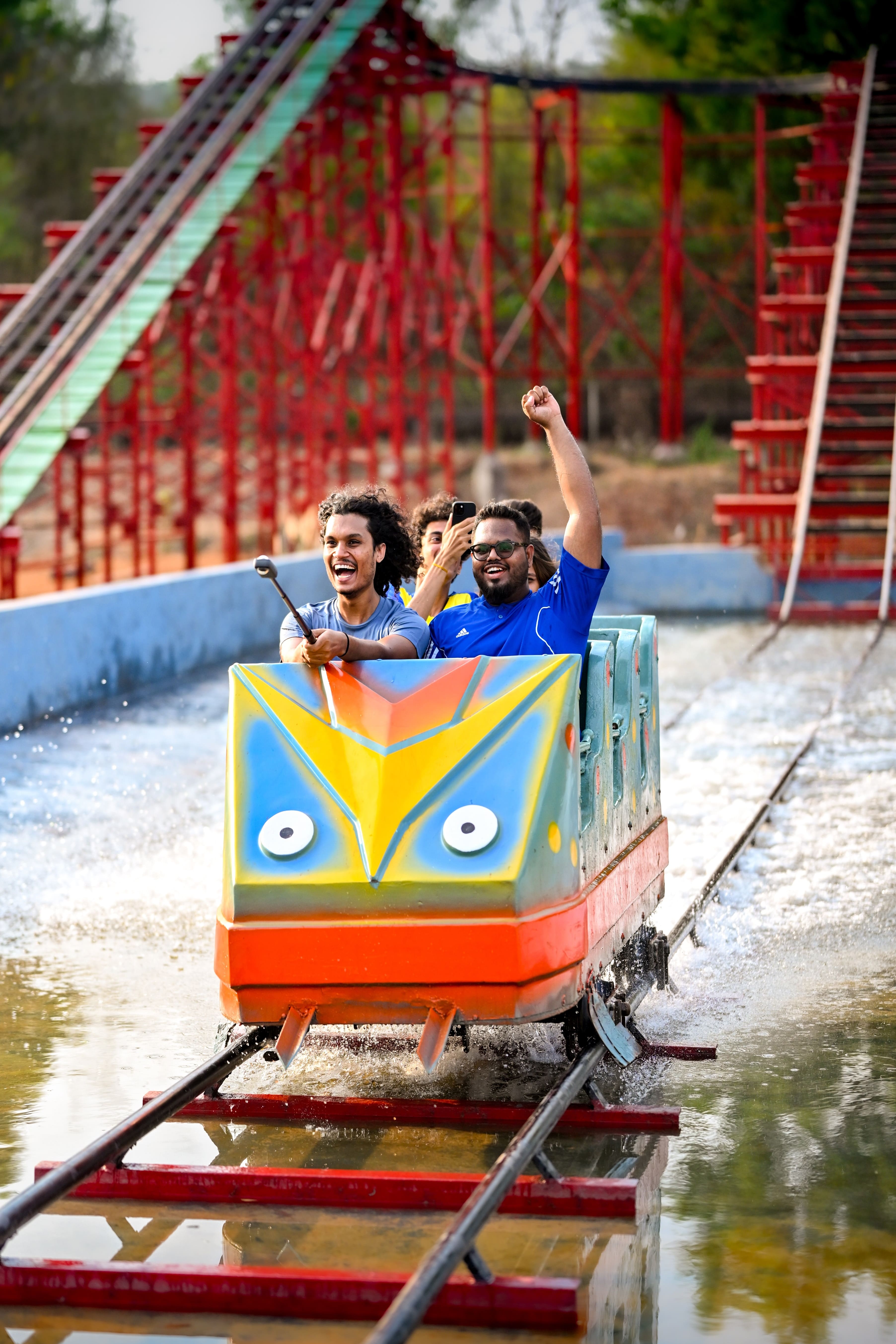 Exciting log flume ride splashing into the water at Goa Aqua World, providing an adrenaline-pumping adventure